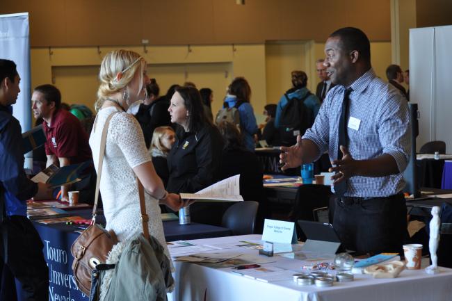 Student talking to recruiter at a career fair